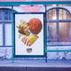 Bus stop advertisement featuring illustration of Burger King and Ronald McDonald kissing above the slogan "Love Conquers All"